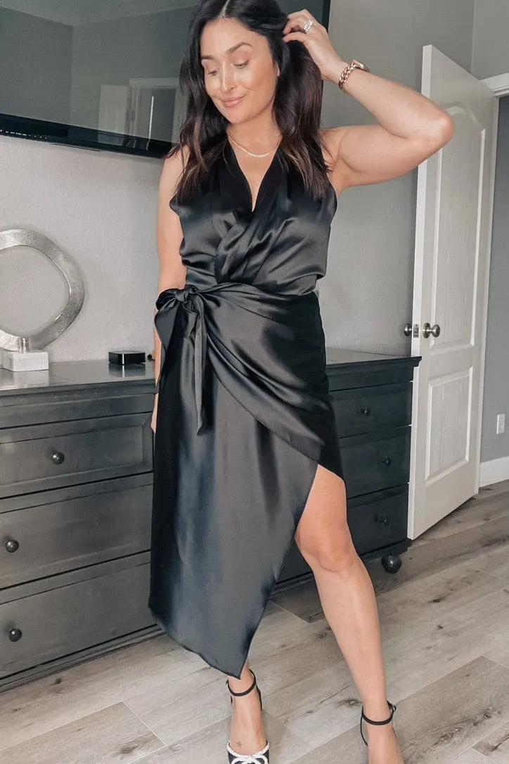 Audrey Sleeveless Asymmetrical Satin Midi Wrap Dress in Black